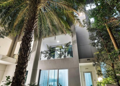 Coastal charm meets elevated elegance at this four-level, modern