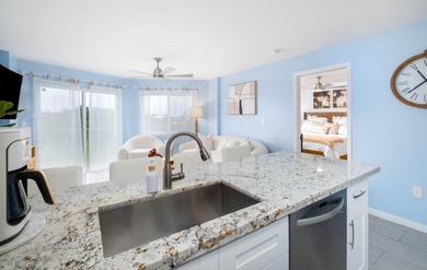 Professionally remodeled and fully furnished, this stunning unit