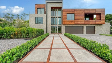 Discover unparalleled modern living at this custom contemporary