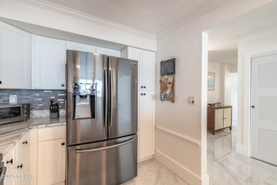 Experience elevated coastal living in this beautifully appointed