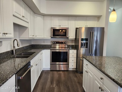 PRICE REDUCED on this comfortable 2-bedroom, 2-bath condo tucked