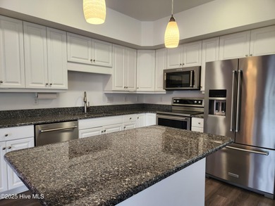 PRICE REDUCED on this comfortable 2-bedroom, 2-bath condo tucked