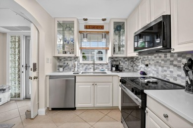 Welcome to waterfront living at sun-swept Unit 203 in