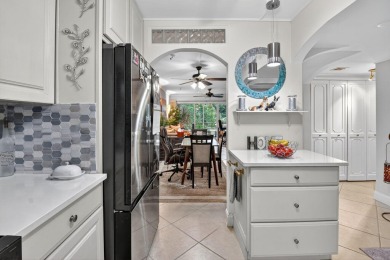 Welcome to waterfront living at sun-swept Unit 203 in