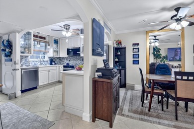 Welcome to waterfront living at sun-swept Unit 203 in