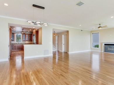 This corner, open-bay and downtown water view villa is truly a