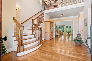 Nestled on a picturesque tree-lined street, this expansive home