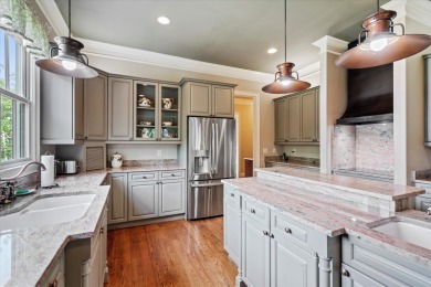 Nestled on a picturesque tree-lined street, this expansive home