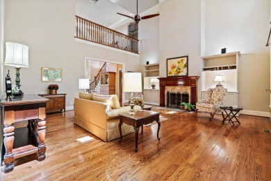 Nestled on a picturesque tree-lined street, this expansive home