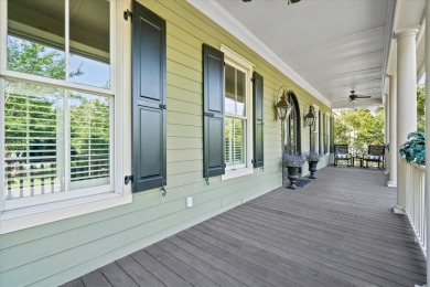 Nestled on a picturesque tree-lined street, this expansive home