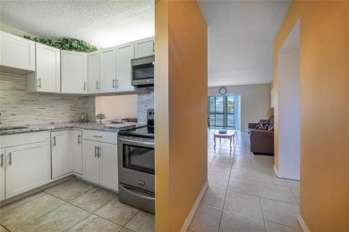 This spacious top-floor 2-bedroom, 2-bath corner condo with