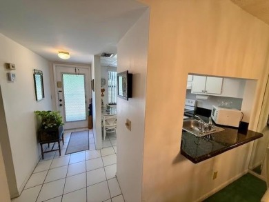 This second-floor unit is located in one of the finest buildings