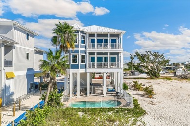 Experience beachfront bliss at this 5-bedroom, 4-bath home