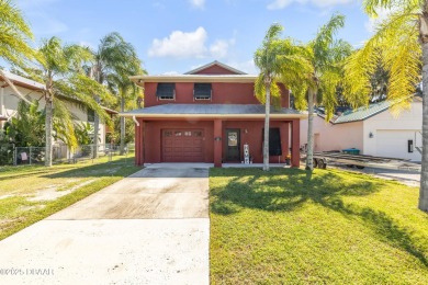 Canal front solid concrete block 3 Br, 2 1/2 Ba home with newly