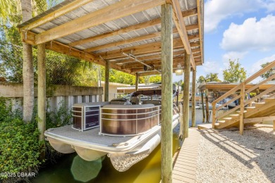 Canal front solid concrete block 3 Br, 2 1/2 Ba home with newly