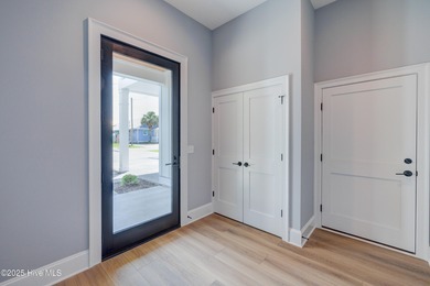 Discover unparalleled coastal living in this stunning newly