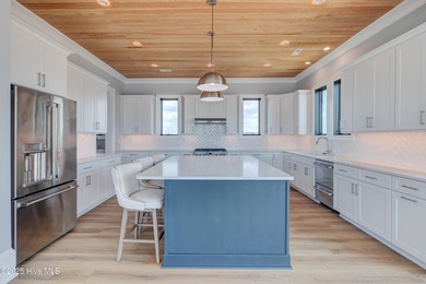 Discover unparalleled coastal living in this stunning newly