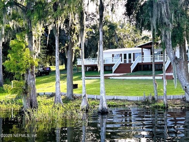 Water-lover's paradise! This lake home oasis is off the beaten