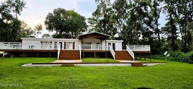 Water-lover's paradise! This lake home oasis is off the beaten
