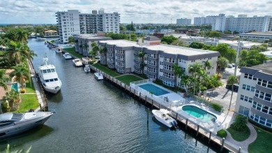 LIVE THE LIFESTYLE IN THIS 2/BED/ 2 BATH CONDO WITH SPLIT FLOOR