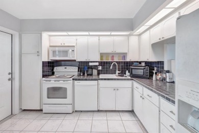 LIVE THE LIFESTYLE IN THIS 2/BED/ 2 BATH CONDO WITH SPLIT FLOOR
