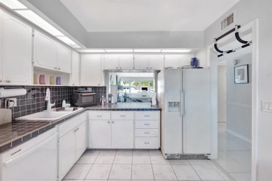 LIVE THE LIFESTYLE IN THIS 2/BED/ 2 BATH CONDO WITH SPLIT FLOOR