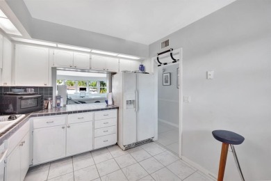 LIVE THE LIFESTYLE IN THIS 2/BED/ 2 BATH CONDO WITH SPLIT FLOOR