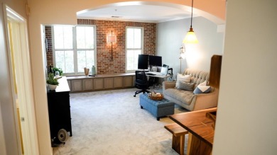 Located in The Plaza community, this stylish, third-floor condo