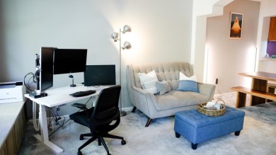 Located in The Plaza community, this stylish, third-floor condo