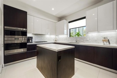 Beach-chic 2-story contemporary glass wrapped corner residence