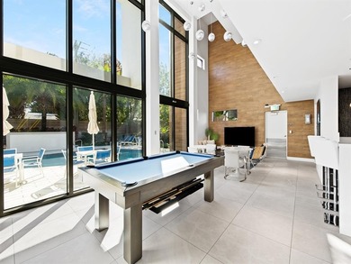 Beach-chic 2-story contemporary glass wrapped corner residence