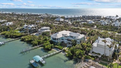 2 DEEP-WATER DOCKS AND A COVERED 10,000 LB LIFT. 5 BEDROOMS AND