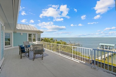 2 DEEP-WATER DOCKS AND A COVERED 10,000 LB LIFT. 5 BEDROOMS AND