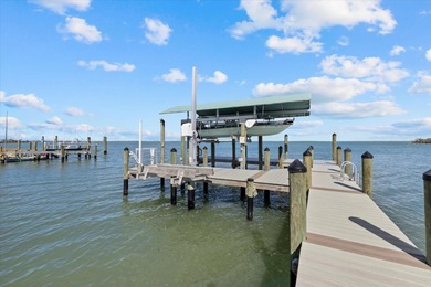 2 DEEP-WATER DOCKS AND A COVERED 10,000 LB LIFT. 5 BEDROOMS AND
