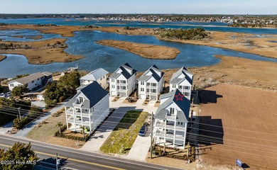 Discover unparalleled coastal living at 607a S Topsail Drive