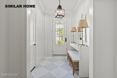 Discover unparalleled coastal living at 607a S Topsail Drive