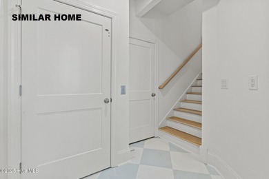 Discover unparalleled coastal living at 607a S Topsail Drive