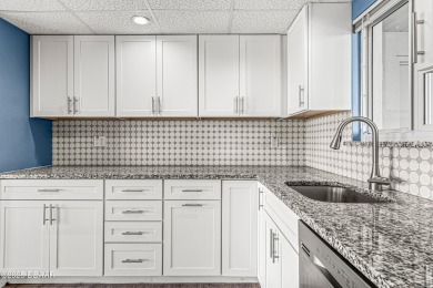 Stunning three bedroom remodeled end unit with panoramic water