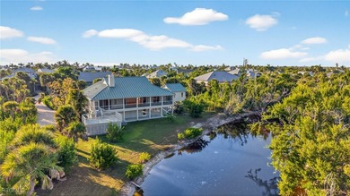 Welcome to 4400 Gulf Pines Drive, an elevated coastal home set