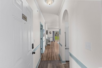 Check out this upgraded first-floor end unit in the prestigious