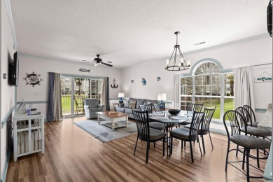 Check out this upgraded first-floor end unit in the prestigious