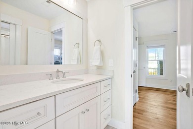 Welcome to 1408 E Beach Drive, where every sunrise feels close