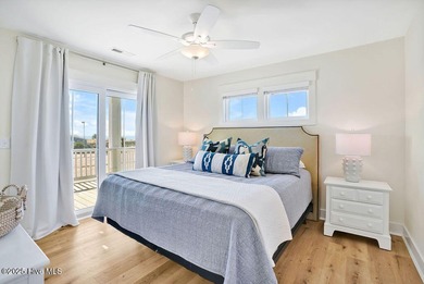 Welcome to 1408 E Beach Drive, where every sunrise feels close