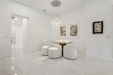 Live the ultimate country club lifestyle in this exquisitely