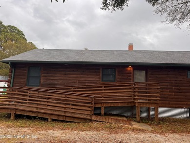 ONE OF A KIND! This beautifully constructed LOG CABIN style home
