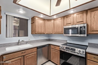 This highly desired ground level home provides great views and