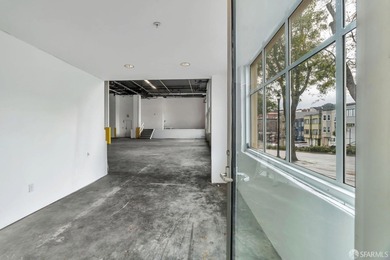 This expansive warehouse/retail condominium offers exceptional