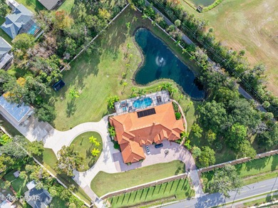 Welcome to 602 Tomoka Avenue - a gated, custom-built estate