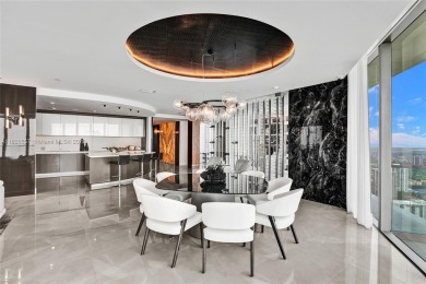 This extraordinary corner unit with unobstructed views,  Armani