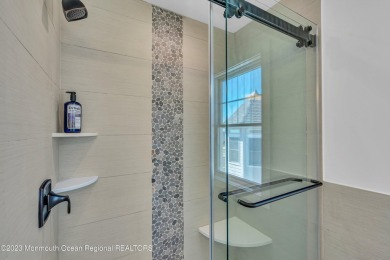 This exquisite newly constructed home features top of the line